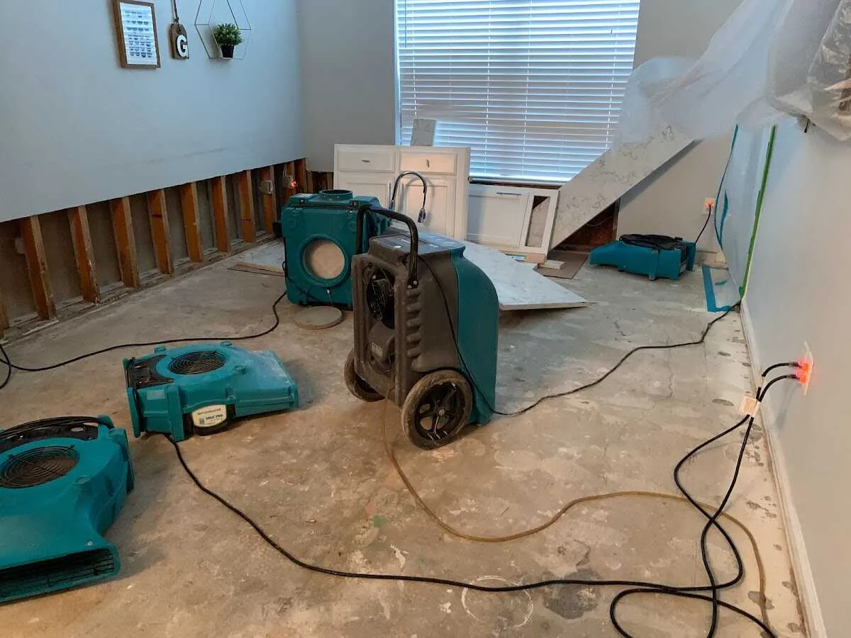 Dehumidifier in flood-cut room for Water Damage Restoration in Forest Park